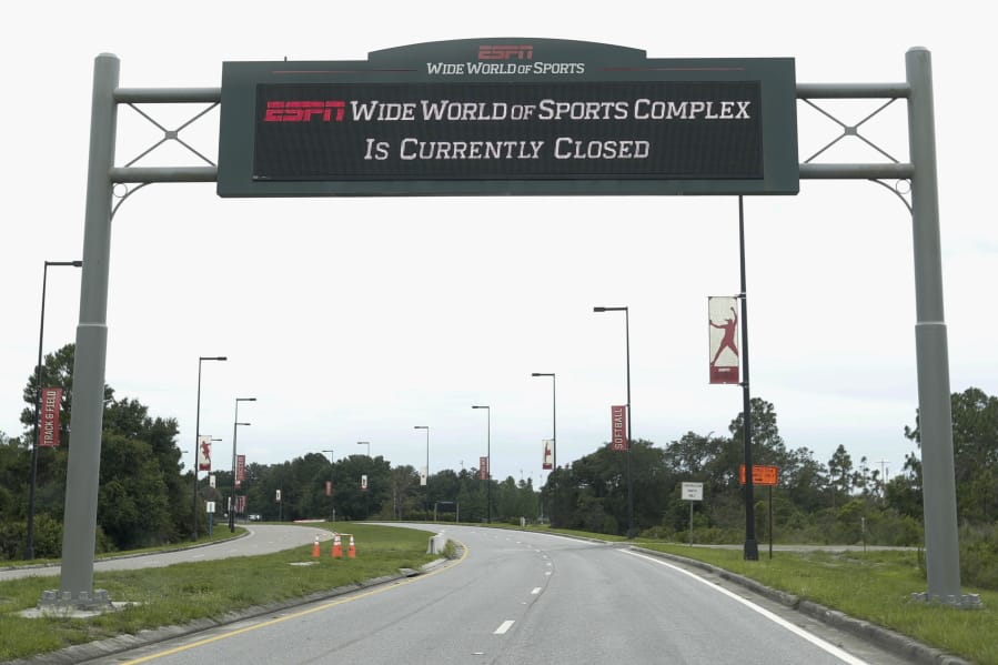 A sign at the entrance to ESPN&#039;s Wide World of Sports at Walt Disney World is seen Wednesday, June 3, 2020, in Kissimmee, Fla. The NBA is set on restarting its season with a 22-team plan at Disney.