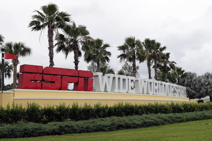 A sign marking the entrance to ESPN&#039;s Wide World of Sports at Walt Disney World is seen Wednesday, June 3, 2020, in Kissimmee, Fla. The NBA has told the National Basketball Players Association that it will present a 22-team plan for restarting the season at Disney.