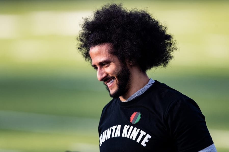 Colin Kaepernick looks on during his NFL workout held at Charles R. Drew High School in Riverdale, Ga., on Nov. 16, 2019.