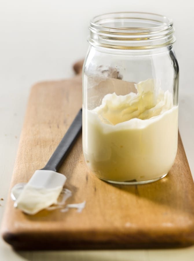 Homemade mayonnaise requires just a few ingredients: An egg, lemon juice or vinegar, mustard, seasoning and oil.