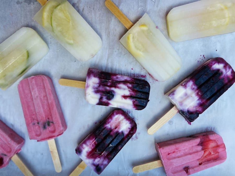 Use purees of fruit, cream, yogurt or simply juice and herbs to make these pretty homemade popsicles.