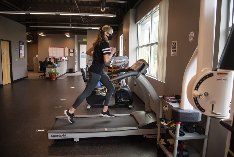 Columbia River graduate Jordan Ryan warms up during physical therapy at ProActive fitness in Vancouver on June 30, 2020. Ryan tore her ACL in March and has been working on physical therapy since her surgery to bring her back to full health.