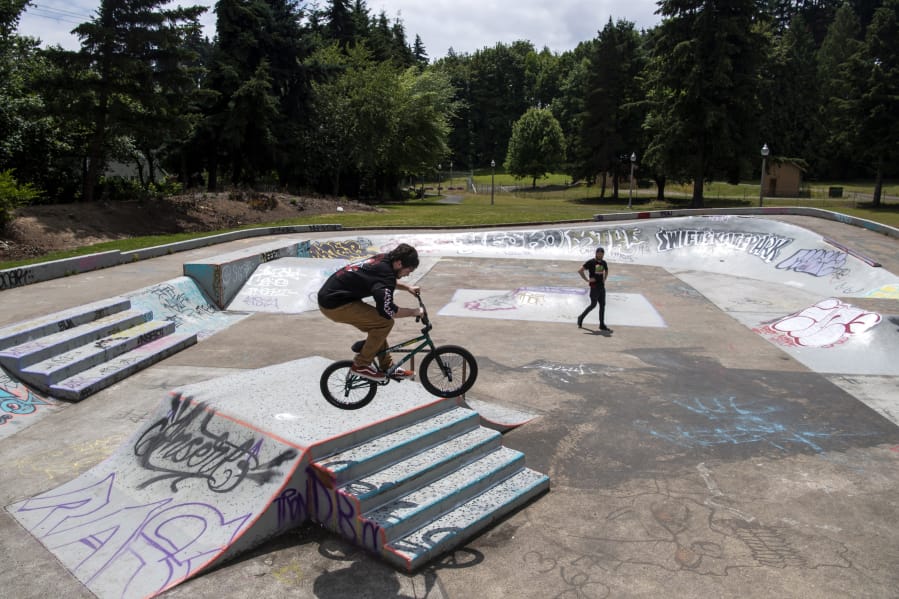 Joseph Moneybrake, left, and Daemion Speckman, both of Portland, bike at Swift Skate Park on Friday. The park reopened on Tuesday. Moneybrake said they noticed many of the skate parks in Portland are still closed, and they wanted to try out a new park.