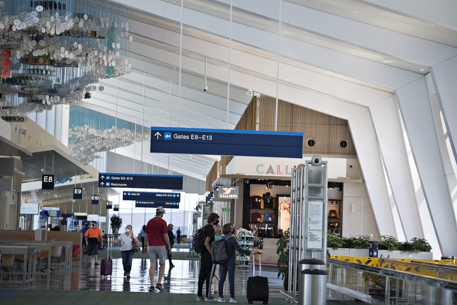 High ceilings and distinctive artwork by Jacob Hashimoto are just a couple of the features of the new section of Concourse E at Portland International Airport, which opened for travel on Wednesday. The extension gives travelers six more gates and is the new home for Southwest Airlines.