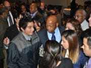 U.S. Rep. John Lewis, the civil rights icon, was a surprise special guest at the 2014 Martin Luther King Jr. Breakfast at Clark College. Here he greets youths with the local League of United Latin American Citizens.