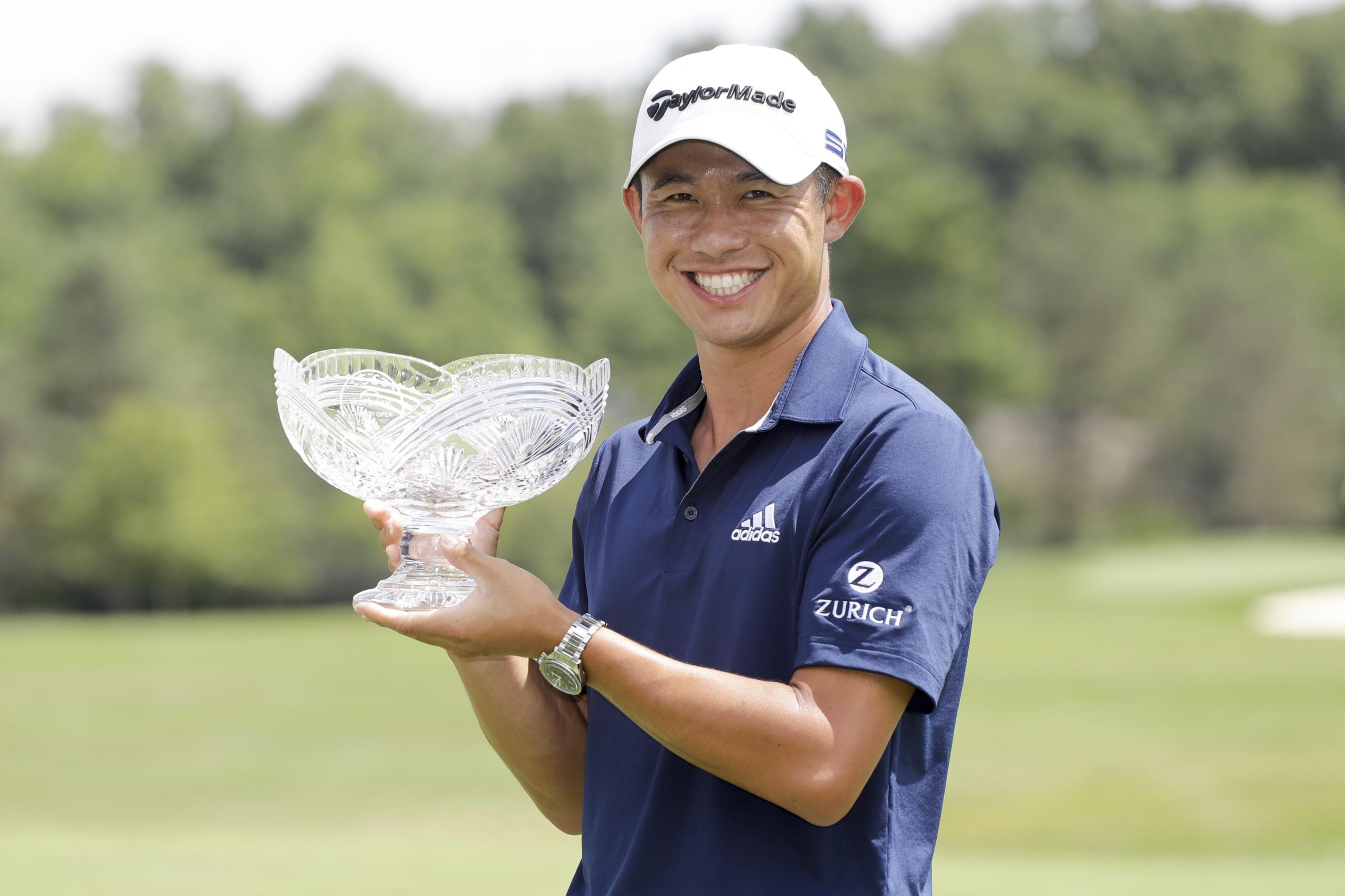Collin Morikawa holds his trophy after winning the Workday Charity Open golf tournament, Sunday, July 12, 2020, in Dublin, Ohio.