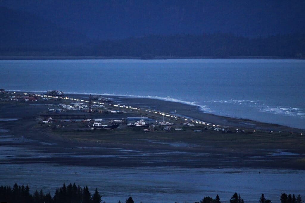 Headlights from a line of cars shine at dusk as people evacuate the Spit in Homer, Alaska, following a powerful earthquake in the Aleutian Islands that prompted a tsunami warning. There were no immediate reports of damage in the sparsely populated area of the state, and the tsunami warning was later canceled.