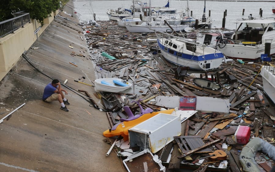 Allen Heath surveys the damage to a private marina after it was hit by Hurricane Hanna, Sunday, July 26, 2020, in Corpus Christi, Texas. Heath&#039;s boat and about 30 others were lost or damaged.