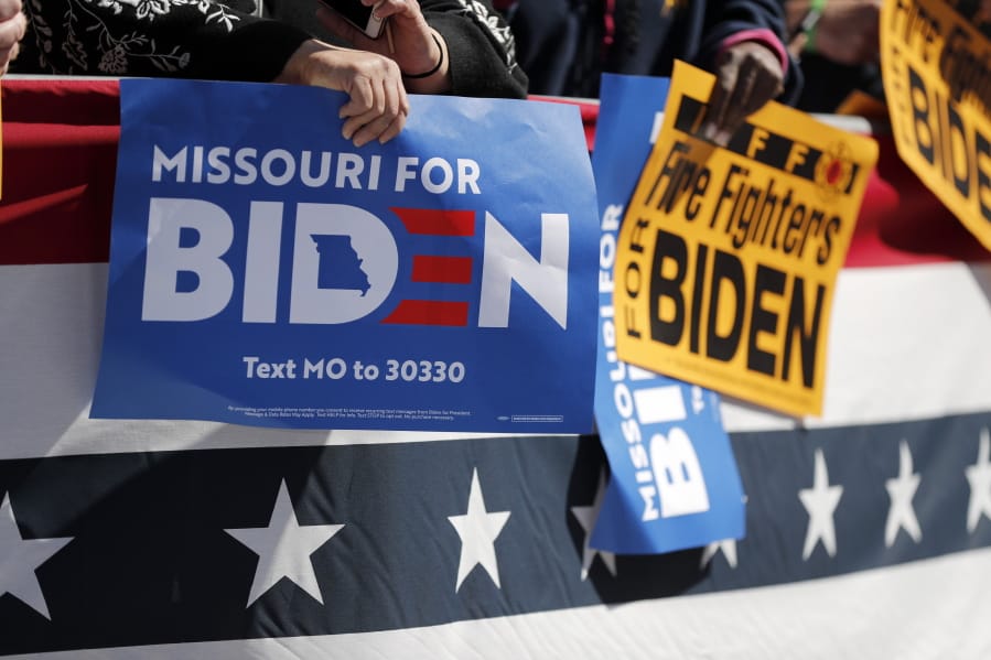 FILE - In this March 7, 2020, file photo supporters wait for Democratic presidential candidate former Vice President Joe Biden to arrive for a campaign rally in St. Louis.  A new poll from The Associated Press-NORC Center for Public Affairs Research finds that Joe Biden&#039;s supporters are less enthusiastic than President Donald Trump&#039;s, both about the campaign itself and their candidate.