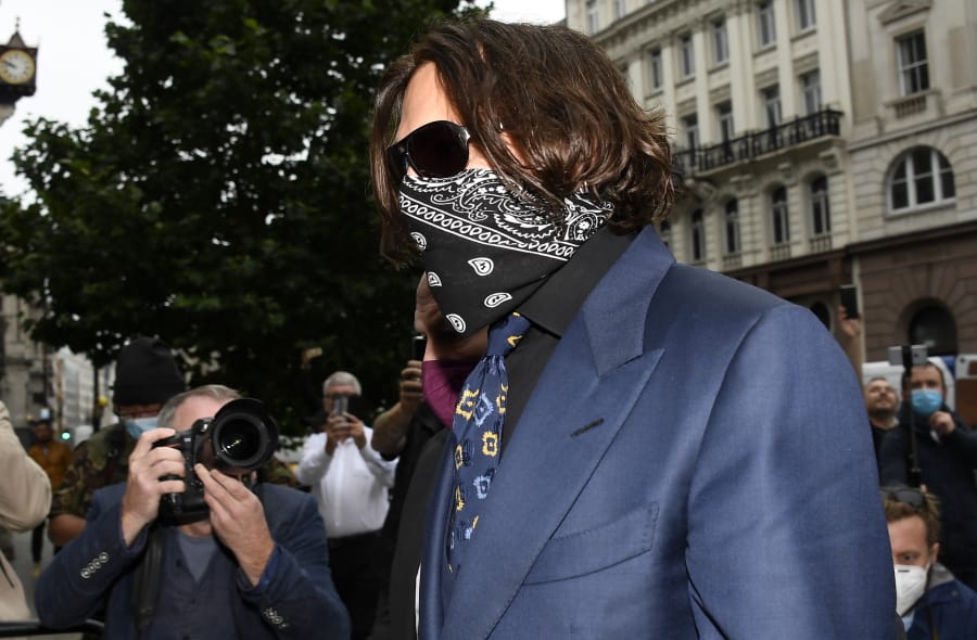 Johnny Depp arrives at the High Court in London, Thursday, July 9, 2020. Johnny Depp is back in the witness box for a third day at the trial of his libel suit against a tabloid newspaper that called him a &quot;wife-beater.&quot; Depp is suing News Group Newspapers, publisher of The Sun, and the paper&#039;s executive editor, Dan Wootton, over an April 2018 article that said he&#039;d physically abused ex-wife Amber Heard.  He strongly denies ever hitting Heard.