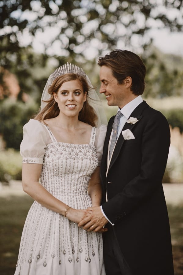 In this photograph released by the Royal Communications of Princess Beatrice and Edoardo Mapelli Mozzi on Sunday, July 19, 2020, Britain&#039;s Princess Beatrice and Edoardo Mapelli Mozzi pose for a photo after their wedding at The Royal Chapel of All Saints at Royal Lodge, Windsor, England. The queen&#039;Aos granddaughter and the property tycoon were married on Friday in the Royal Chapel of All Saints at Royal Lodge, Windsor. The 94-year-old British monarch and her 99-year-old husband Prince Philip attended, along with the parents and siblings of the bride and groom.