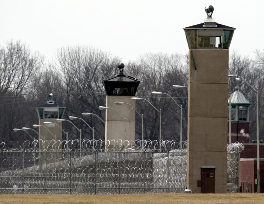 FILE - In this March 17, 2003 file photo, guard towers and razor wire ring the compound at the U.S. Penitentiary in Terre Haute, Ind., the site of the last federal execution. After the latest 17-year hiatus, the Trump administration wants to restart federal executions this month at the Terre Haute, prison. Four men are slated to die. All are accused of murdering children in cases out of Arkansas, Kansas Iowa and Missouri.