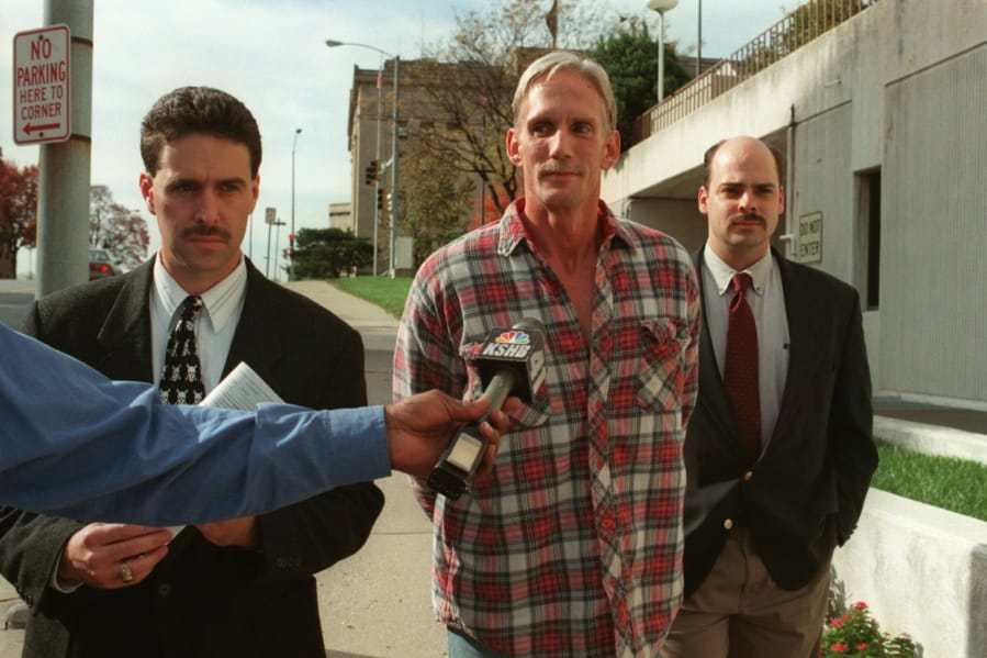 In this 1998 photo, Wesley Ira Purkey, center, is escorted by police officers in Kansas City, Kan., after he was arrested in connection with the death of 80-year-old Mary Ruth Bales. Purkey was also convicted of kidnapping and killing a 16-year-old girl and is scheduled to be executed on July 15, 2020, in Terre Haute, Ind.