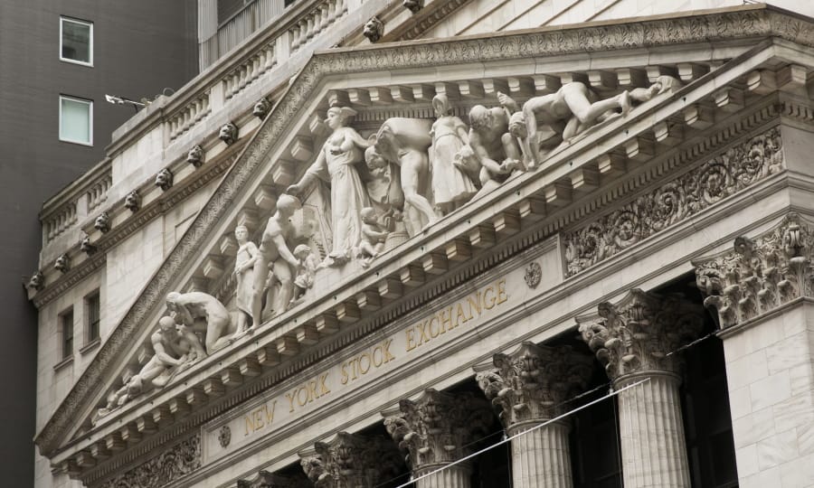 FILE - This June 30, 2020, file photo, shows the facade of the New York Stock Exchange. U.S. stocks are dipping modestly in early trading Tuesday, July 7, 2020, as expanding coronavirus outbreaks dim hopes for a speedy recovery.