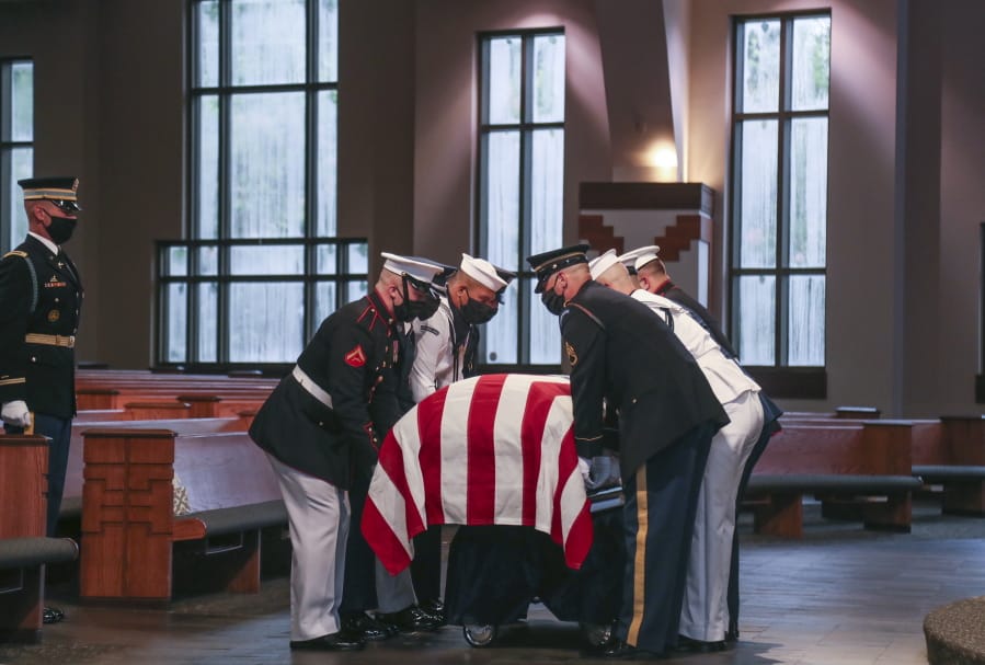 Members of an Honor Guard place the casket of the late Rep. John Lewis, D-Ga., for the funeral service at Ebenezer Baptist Church in Atlanta, Thursday, July 30, 2020.