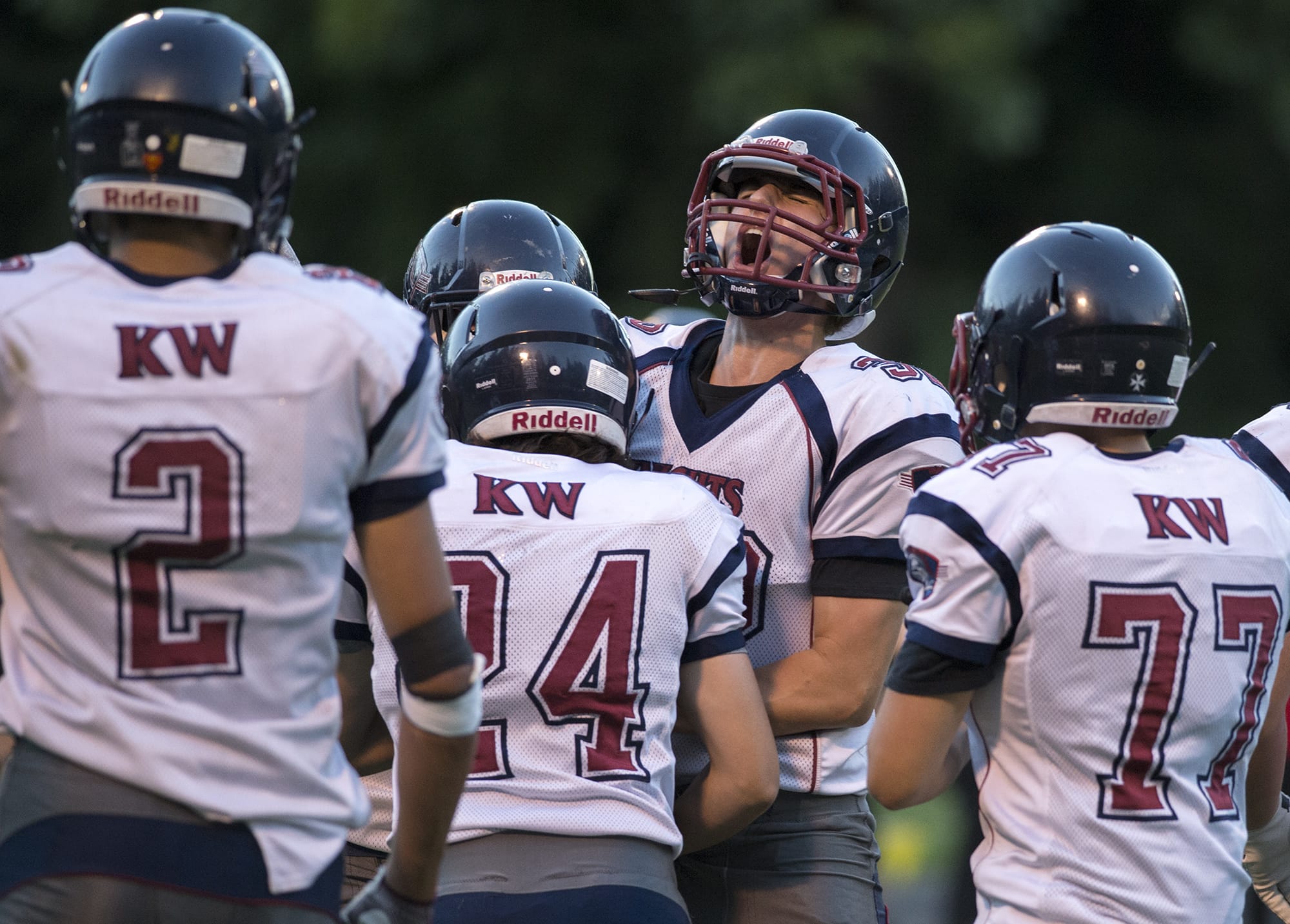 King's Way players celebrate after an interception in the first quarter at Kiggins Bowl on Thursday evening, Aug. 31, 2017.