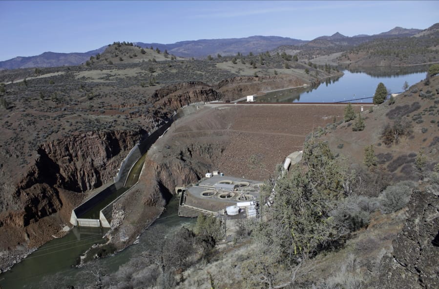 FILE - This March 3, 2020, file photo shows the Iron Gate Dam, powerhouse and spillway are on the lower Klamath River near Hornbrook, Calif. Federal regulators on Thursday, July 16, 2020, threw a significant curveball at a coalition that has been planning for years to demolish four massive hydroelectric dams on a river along the Oregon-California border to save salmon.