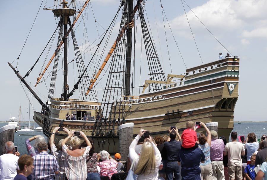 FILE - In this June 6, 2016 file photo, people on a wharf watch as the Mayflower II arrives in Plymouth Harbor in Plymouth, Mass. After undergoing more than three years of major renovations at Connecticut&#039;s Mystic Seaport and months of delays due to the COVID-19 pandemic, the replica of the Mayflower is is set to leave Mystic Seaport on Monday, July 20, 202 for a sea trials in New London, before sailing up the coast and arriving at Plimoth Plantation in Massachusetts on during the second week of August.