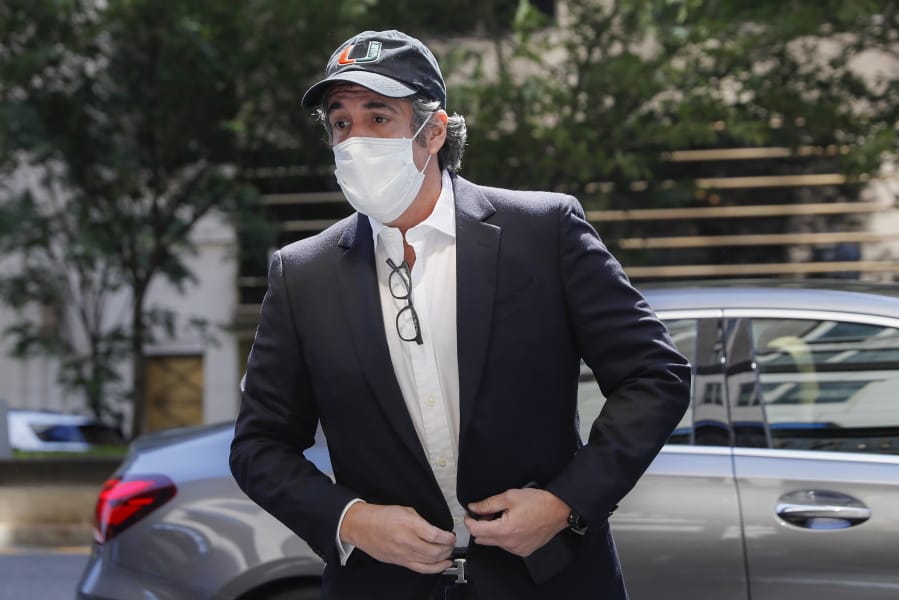 FILE- In this May 21, 2020 file photo, Michael Cohen arrives at his Manhattan apartment in New York after being furloughed from prison because of concerns over the coronavirus. A judge ordered the release from prison, Thursday, July 23 of President Donald Trump&#039;s former personal lawyer, saying he believes the government retaliated against him for writing a book about Trump. Cohen sued federal prison officials including Attorney General William Barr on Monday, July 20 saying he was returned to an Otisville, New York, prison to stop him from publishing a tell-all book about his experiences with Trump.