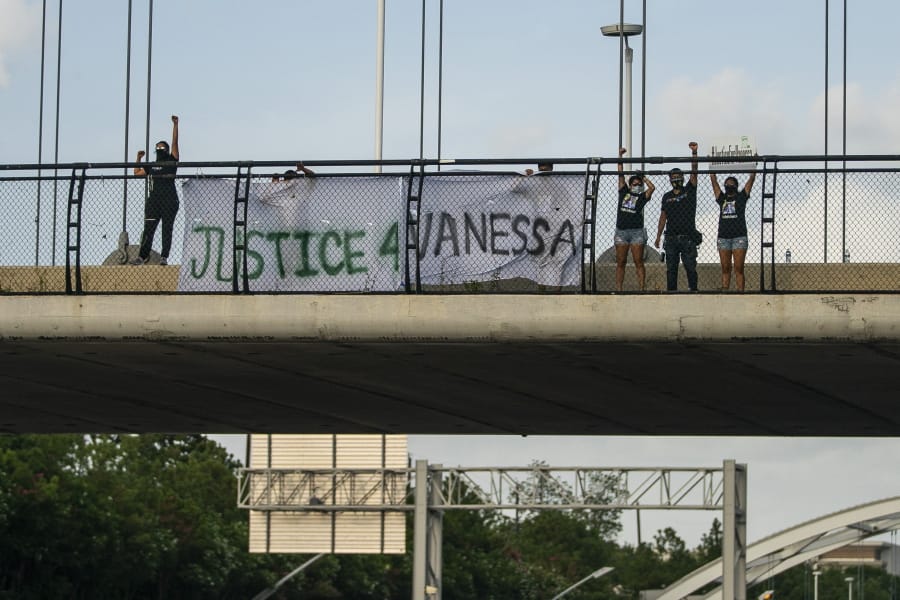 Members of #TeamVanessa and FIEL Houston gather demanding justice for Army Spc. Vanessa Guillen on the Dunlavy Street bridge that goes over the Southwest Freeway in Houston on Wednesday, July 8, 2020.