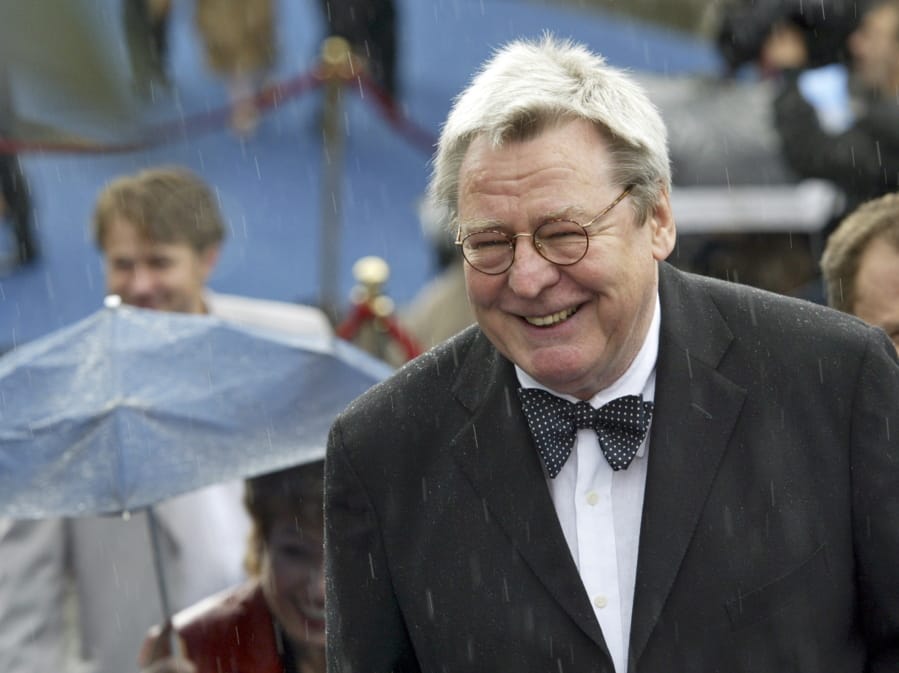 FILE - Film director Alan Parker arrives at the opening ceremony of 26th Moscow International Film Festival in Moscow on June 18, 2004. Parker, whose movies included &quot;Bugsy Malone,&quot; &quot;Midnight Express&quot; and &quot;Evita,&quot; has died at the age of 76. A statement from the director&#039;s family says Parker died Friday in London after a long illness.