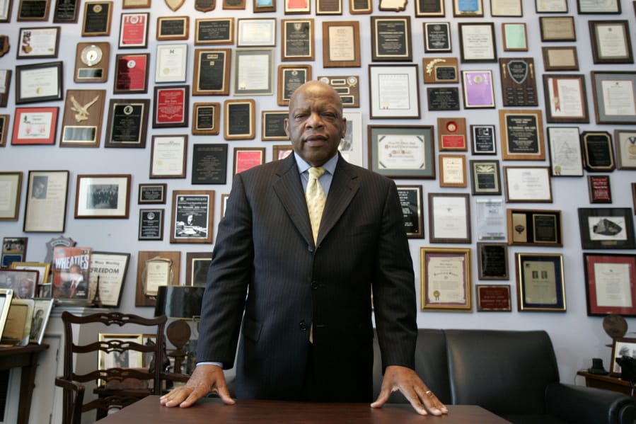 CORRECTS POLITICAL PARTY FROM REPUBLICAN TO DEMOCRAT - FILE - In this Thursday, May 10, 2007 file photo, U.S. Rep. John Lewis, D-Ga., in his office on Capitol Hill, in Washington. Lewis, who carried the struggle against racial discrimination from Southern battlegrounds of the 1960s to the halls of Congress, died Friday, July 17, 2020.