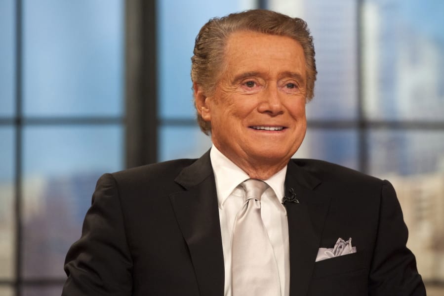 FILE - In this Nov. 18, 2011 file photo, Regis Philbin appears on his farewell episode of &quot;Live! with Regis and Kelly&quot;, in New York. Philbin, the genial host who shared his life with television viewers over morning coffee for decades and helped himself and some fans strike it rich with the game show &quot;Who Wants to Be a Millionaire,&quot; has died on Friday, July 24, 2020.