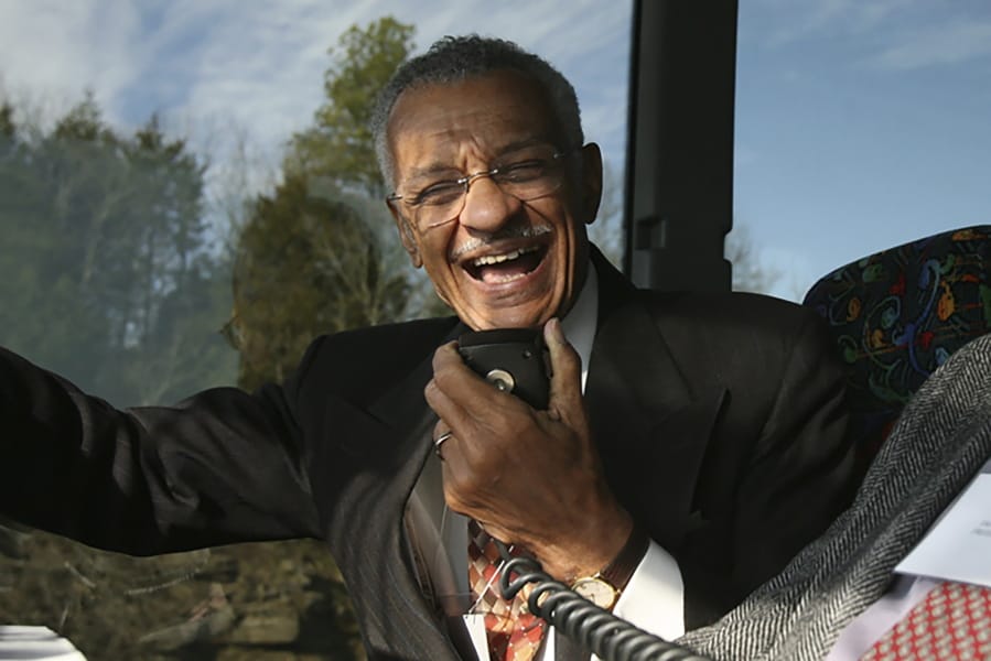 FILE - In this Jan. 27, 2007, file photo, C.T. Vivian uses an intercom with Rev. James Lawson on a bus in Montgomery, Ala., to discuss the experiences they encountered in 1961 as Freedom Riders, a group of college students who defied segregation on interstate buses across the American South. The Rev. Vivian, a civil rights veteran who worked alongside the Rev. Martin Luther King Jr. and served as head of the organization co-founded by the civil rights icon, has died at home in Atlanta of natural causes Friday morning, July 17, 2020 his friend and business partner Don Rivers confirmed to The Associated Press. Vivian was 95.