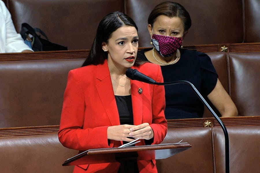 In this image from video, Rep. Alexandria Ocasio-Cortez, D-N.Y., speaks on the House floor, Thursday, July 23, 2020 on Capitol Hill in Washington.   Ocasio-Cortez&#039;s objections to a Republican lawmaker&#039;s verbal assault on her expanded Thursday as she and other Democrats took to the House floor to demand an end to a sexist culture of &quot;accepting violence and violent language against women.&quot;  Rep. Nydia Velazquez, D-N.Y., is seated right.