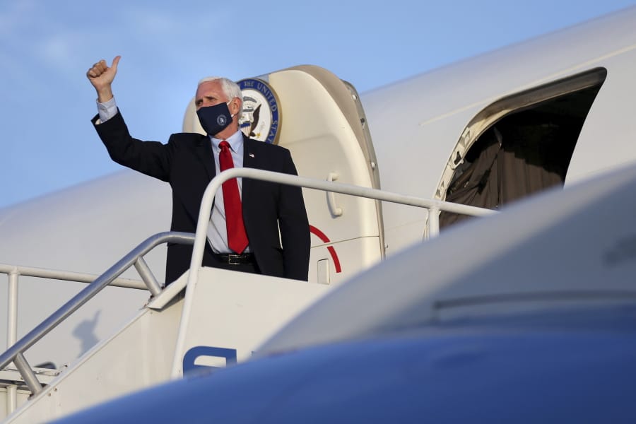Vice President Mike Pence gives a thumbs-up before departing on Air Force Two from Philadelphia International Airport after a series of stops in Pennsylvania on Thursday, July 9, 2020.
