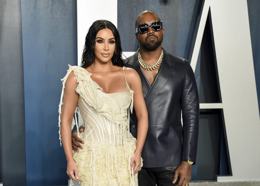FILE -Kim Kardashian West, left, and Kanye West arrive at the Vanity Fair Oscar Party in Beverly Hills, Calif. on Feb. 9, 2020. Kardashian West is asking the public to show compassion and empathy to husband Kanye West, who she says is bipolar and caused a stir this week after fulminating in a series of social media posts. The reality TV star posted a lengthy message Wednesday on her Instagram Live feed, explaining that life has been complicated for her family and West, who ranted against historical figure Harriet Tubman and discussed abortion on Sunday while he declared himself a presidential candidate.