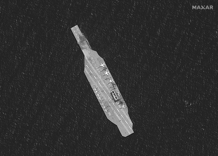 In this Tuesday, July 28, 2020, satellite photo provided by Maxar Technologies, a mockup aircraft carrier built by Iran is seen damaged in the Strait of Hormuz amid a live-fire drill conducted by Iran&#039;s Revolutionary Guard. The Guard fired a missile from a helicopter targeting a replica aircraft carrier in the strategic Strait of Hormuz, state television reported on Tuesday, an exercise aimed at threatening the U.S. amid tensions between Tehran and Washington.