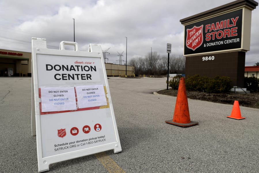 FILE - In this April 1, 2020 file photo, a closed sign is displayed outside a Salvation Army store and donation center in Glenview, Ill. Across the country, drug and alcohol recovery programs claiming to help the poor and the desperate are instead conscripting them into forms of indentured servitude, requiring them to work without pay or for pennies on the dollar, in exchange for their stay. For the first time, Reveal from The Center for Investigative Reporting has determined how widespread these programs have become. In 1990, in response to a complaint from a former participant, the Labor Department launched an investigation into the nation&#039;s largest chain of work-based rehabs, The Salvation Army, which operates about 100 programs across the country. At The Salvation Army&#039;s rehabs, participants were required to work full time processing donations for the organization&#039;s thrift stores, receiving a stipend of only $5 to $20 a week. The department found The Salvation Army had violated labor laws and ordered the nonprofit to pay its participants minimum wage. The Salvation Army refused to comply. It sued, then enlisted members of Congress to defend the venerable charity. Within a month, the department backed off.(AP Photo/Nam Y.