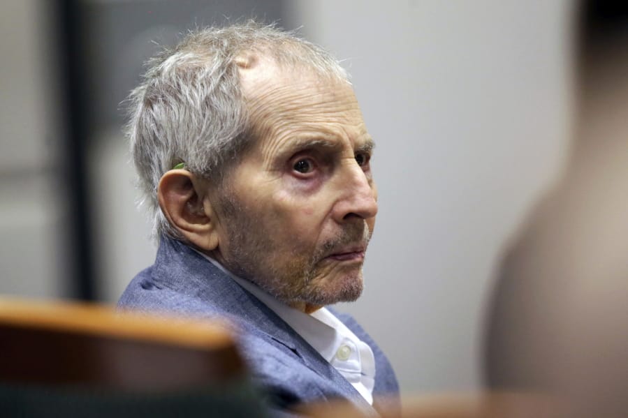 FILE - In this March 10, 2020, file photo, real estate heir Robert Durst looks over during his murder trial in Los Angeles. At a hearing Friday, July 17, 2020, on the resumption of the murder trial of Durst, a Los Angeles judge said it won&#039;t resume in late July as planned, and may stay on hold until April.