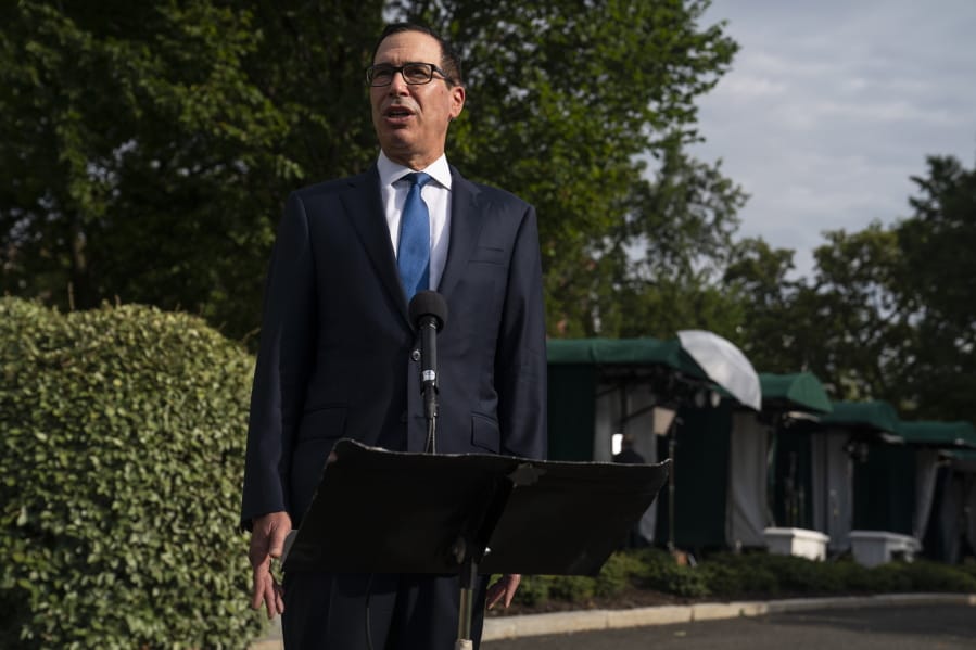 Treasury Secretary Steven Mnuchin speaks with reporters about the coronavirus relief package negotiations, at the White House, Thursday, July 23, 2020, in Washington.
