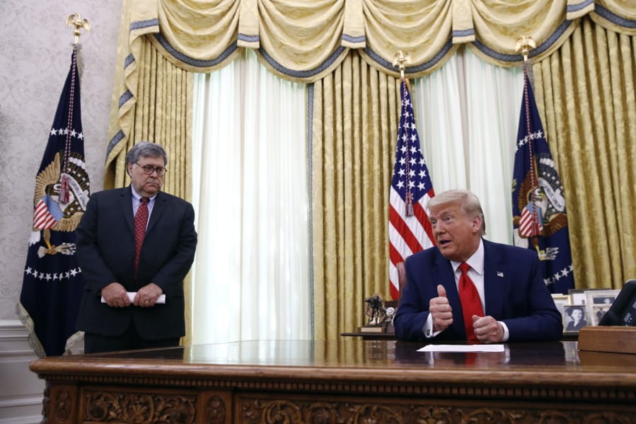 President Donald Trump speaks alongside Attorney General William Barr during a law enforcement briefing on the MS-13 gang in the Oval Office of the White House, Wednesday, July 15, 2020, in Washington.