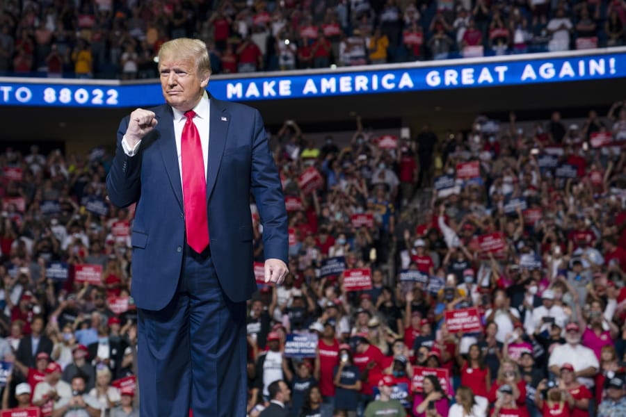 President Donald Trump arrives on stage to speak at a campaign rally at the BOK Center, Saturday, June 20, 2020, in Tulsa, Okla.  Trump is asking Americans to let him keep his job. His critics are asking how much of that job he&#039;s actually doing. Those questions have gotten louder in recent days following revelations that Trump didn&#039;t read at least two written intelligence briefings detailing concerns that Russia was paying bounties to the Taliban for the deaths of Americans in Afghanistan.