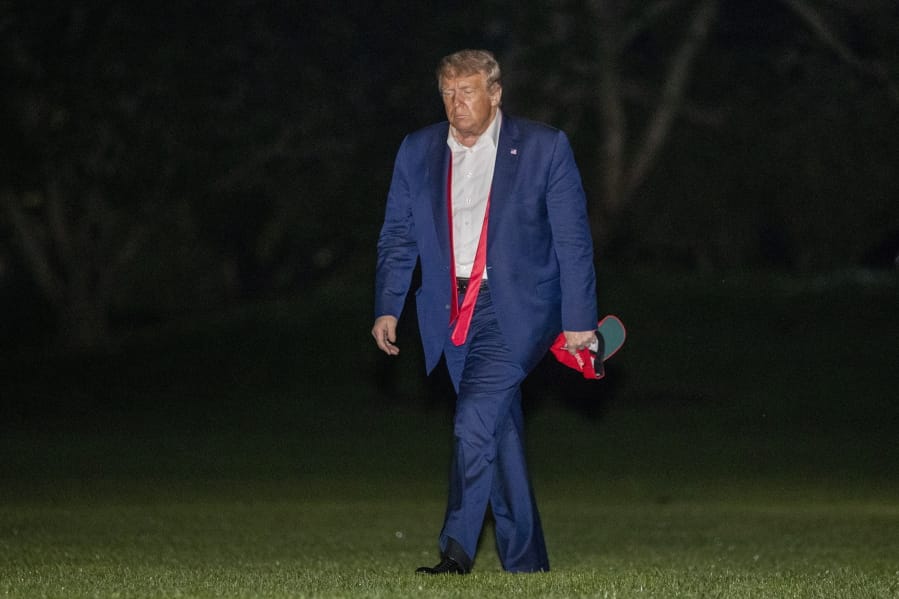 FILE - In this June 21, 2020, file photo, President Donald Trump walks on the South Lawn of the White House in Washington, after stepping off Marine One as he returns from a campaign rally in Tulsa, Okla.