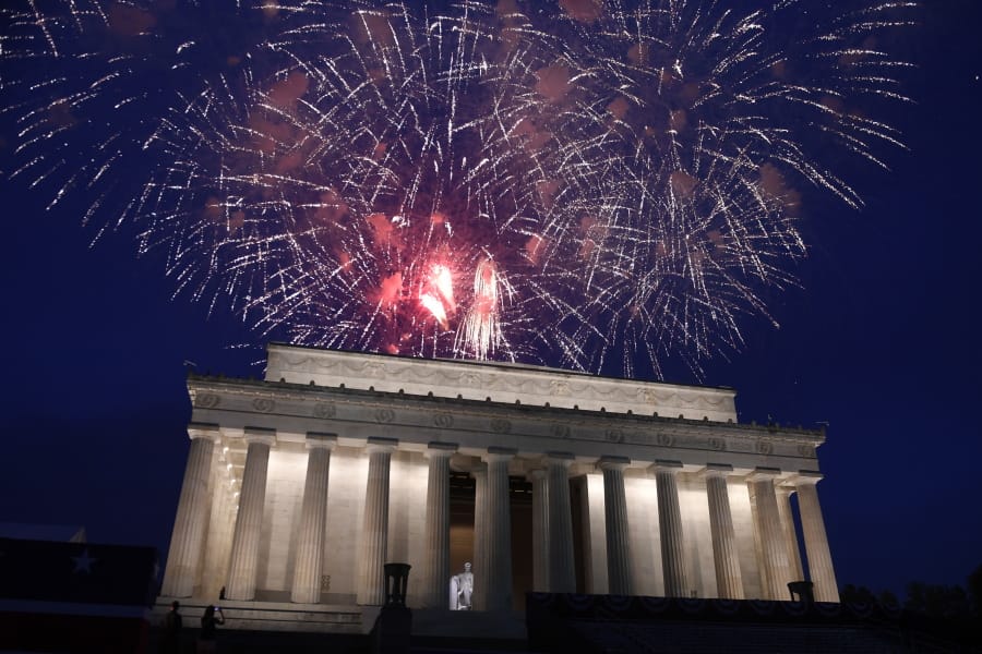 FILE - In this July 4, 2019 file photo, fireworks go off over the Lincoln Memorial in Washington, Thursday, July 4, 2019. The Trump administration is promising one of the largest fireworks displays in recent memory for Washington on July 4. It also plans to give away as many as 300,000 face masks to those who come down to the National Mall, although they won&#039;t be required to wear them.