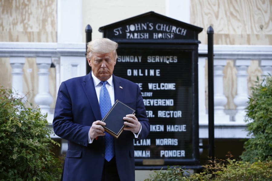 FILE - In this Monday, June 1, 2020 file photo, President Donald Trump holds a Bible during a visit outside St. John&#039;s Church across Lafayette Park from the White House in Washington. Polling released by the nonpartisan Pew Research Center on Wednesday, July 1, 2020 finds that Trump&#039;s strong approval among white evangelicals -- a cornerstone of his political base -- remains intact in the wake of the previous month&#039;s photo op at the church, which sparked criticism from some religious leaders, and the Supreme Court&#039;s ruling to protect LGBT people from employment discrimination.