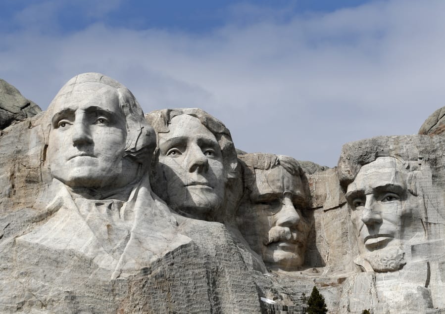 FILE - This March 22, 2019, file photo shows Mount Rushmore in Keystone, S.D.  President Donald Trump will begin his Independence Day weekend on Friday with a patriotic display of fireworks at Mount Rushmore National Memorial before a crowd of thousands.