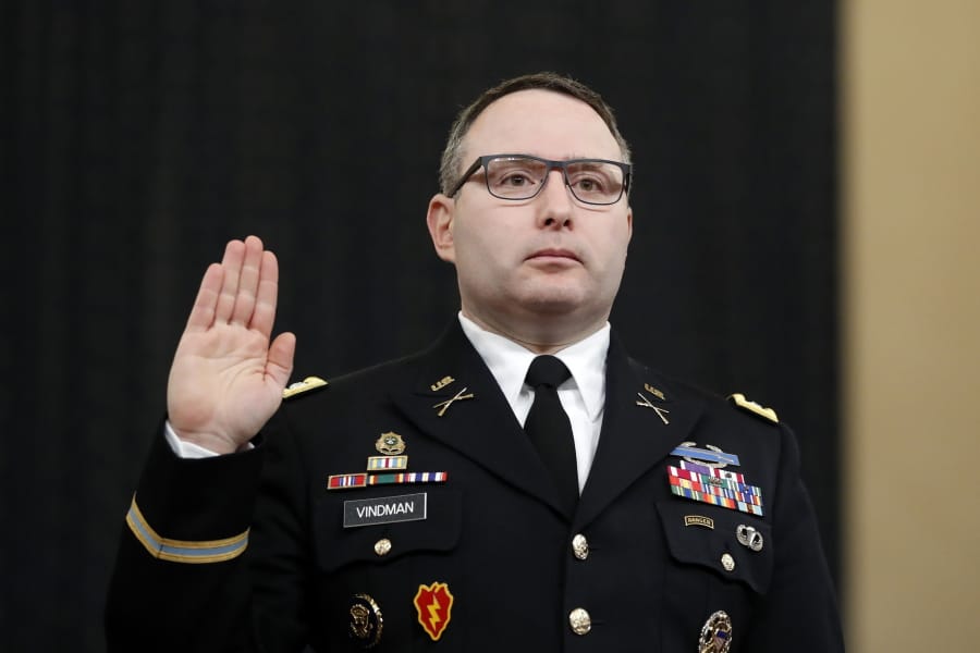 FILE - In this Nov. 19, 2019, file photo National Security Council aide Lt. Col. Alexander Vindman is sworn in to testify before the House Intelligence Committee on Capitol Hill in Washington.