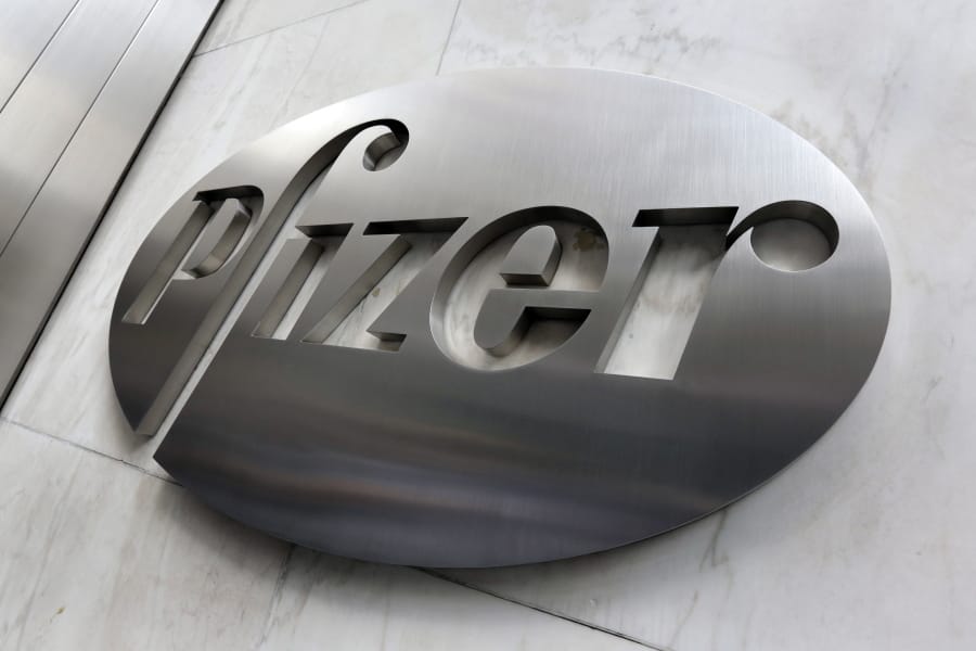 File- This Dec. 4, 2017, photo shows the Pfizer company logo at the company&#039;s headquarters in New York.  The federal government has agreed to pay nearly $2 billion for 100 million doses of a potential COVID-19 vaccine being developed by the U.S. drugmaker and its German partner BioNTech.