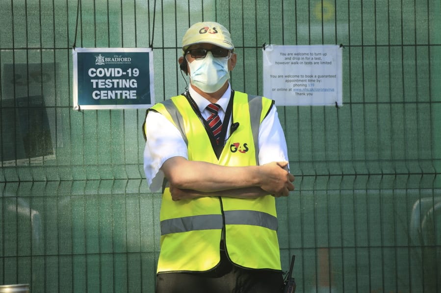 A security guard outside a Covid-19 testing centre, in Bradford, West Yorkshire, England, Friday July 31, 2020. Britain&#039;s health secretary has defended a decision to reimpose restrictions on social life in a swath of northern England, saying it was important to keep ahead of the spread of COVID-19. Under the new restrictions, people from different households in Greater Manchester, England&#039;s second largest metropolitan area, have been asked to not meet indoors. The same orders applies to the surrounding areas of Lancashire and West Yorkshire counties.