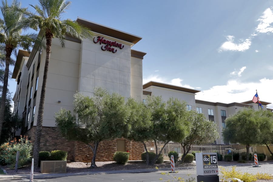 A Hampton Inn is shown Tuesday, July 21, 2020 in Phoenix.  The Trump administration is detaining immigrant children as young as 1 in hotels before deporting them to their home countries. Documents obtained by The Associated Press show a private contractor hired by U.S. Immigration and Customs Enforcement is taking children to three Hampton Inns in Arizona and Texas under restrictive border policies implemented during the coronavirus pandemic.