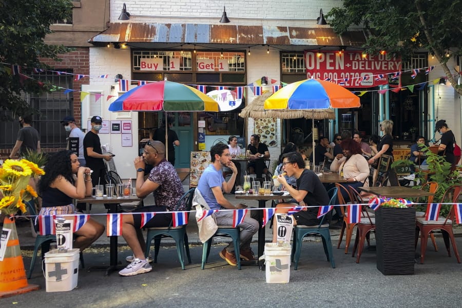 Diners eat al fresco due to COVID-19 concerns in the West Village, Friday, June 26, 2020, in New York. New York City Mayor Bill de Blasio says he&#039;s delaying the planned resumption of indoor dining at restaurants in the city out of fear it would ignite a spike in coronavirus infections.