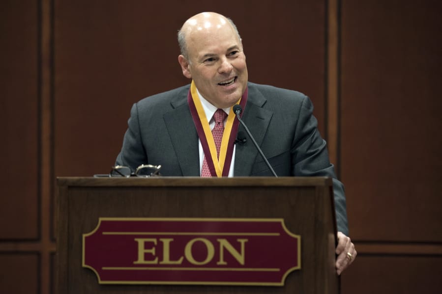 FILE - In this March 1, 2017, file photo, Elon Trustee Louis DeJoy is honored with Elon&#039;s Medal for Entrepreneurial Leadership in Elon. N.C. Mail deliveries could be delayed by a day or more under cost-cutting efforts being imposed by the new postmaster general, DeJoy. The plan eliminates overtime for hundreds of thousands of postal workers and says employees must adopt a &quot; different mindset&quot; to ensure the Postal Service&#039;s survival during the coronavius pandemic.