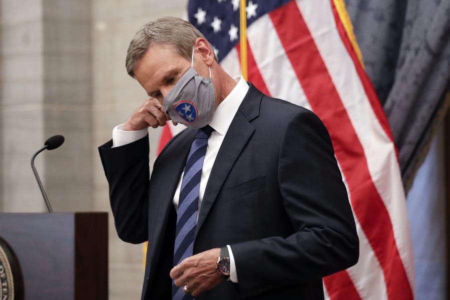 Tennessee Gov. Bill Lee removes his mask as he begins a news conference Wednesday, July 1, 2020, in Nashville, Tenn.