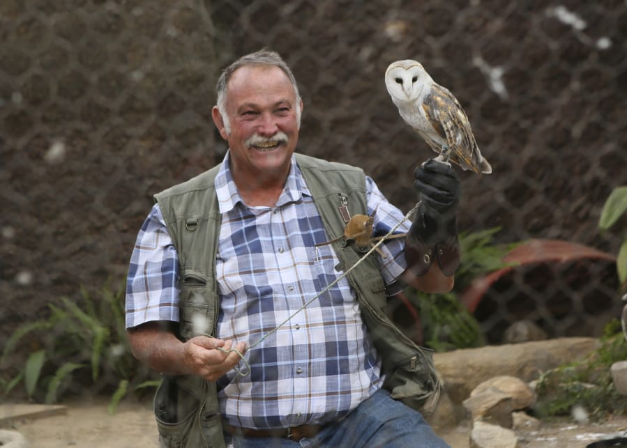 Gary Strafford, a Zimbabwean falconer, holds an owl inside one of the cages at his bird sanctuary, Kuimba Shiri, near Harare, Zimbabwe, Wednesday, June, 17, 2020. Kuimba Shiri, Zimbabwe&#039;s only bird park, has survived tumultuous times, including violent land invasions and a devastating economic collapse. Now the outbreak of COVID-19 is proving a stern test. With Zimbabwe&#039;s inflation currently at more than 750%, tourism establishments are battling a vicious economic downturn worsened by the new coronavirus travel restrictions.