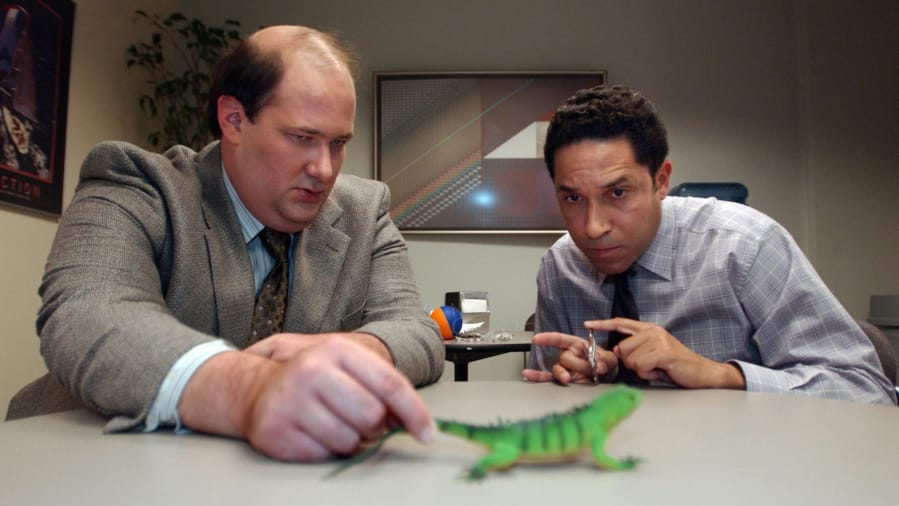 Brian Baumgartner, left, as Kevin Malone, and Oscar Nunez, as Oscar, demonstrate Hate Ball on the set of the TV show &quot;The Office.&quot; (Tribune News Services)